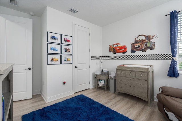 5651 Trevesta Pl, Palmetto, FL 34221 - bedroom featuring wood finished floors and baseboards