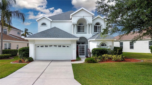 6307 Laurel Creek Trl, Ellenton, FL 34222 - view of front of home with an attached garage, stucco siding, a front yard, and a shingled roof