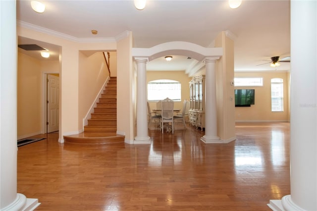 6307 Laurel Creek Trl, Ellenton, FL 34222 - foyer with ornate columns, stairs, arched walkways, light wood-type flooring, and a ceiling fan
