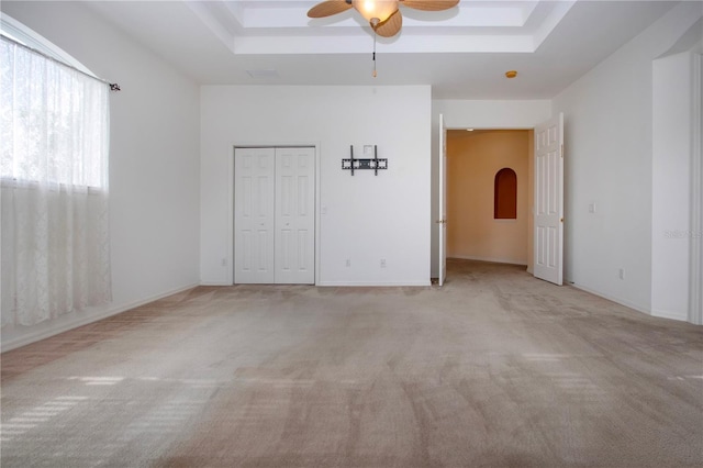 6307 Laurel Creek Trl, Ellenton, FL 34222 - unfurnished bedroom featuring a raised ceiling, carpet floors, arched walkways, and ceiling fan