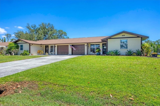 217 High Point Dr Unit 217A, Englewood, FL 34223 - ranch-style home featuring an attached garage, stucco siding, a front yard, and concrete driveway