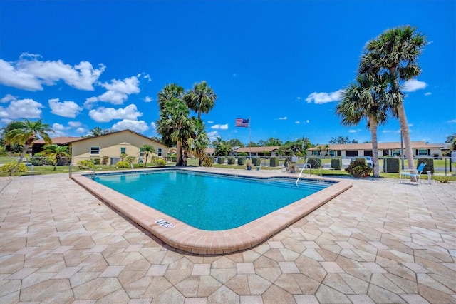 217 High Point Dr Unit 217A, Englewood, FL 34223 - community pool with a patio area and fence