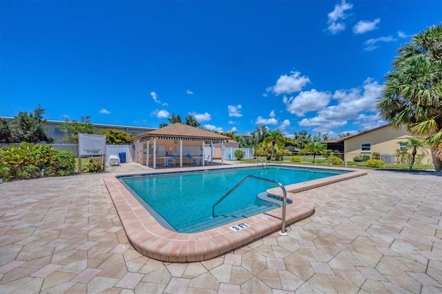 217 High Point Dr Unit 217A, Englewood, FL 34223 - community pool featuring a gazebo, fence, and a patio