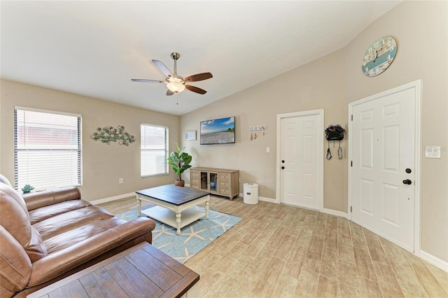 4115 2nd Ave NW, Bradenton, FL 34209 - living room featuring lofted ceiling, ceiling fan, light wood finished floors, and baseboards
