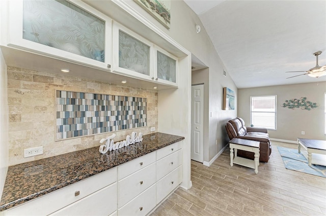 4115 2nd Ave NW, Bradenton, FL 34209 - kitchen with baseboards, open floor plan, a ceiling fan, and white cabinets