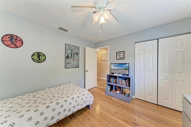 4115 2nd Ave NW, Bradenton, FL 34209 - bedroom with light wood-style flooring, a closet, baseboards, and ceiling fan