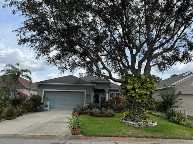817 Tallgrass Ln, Bradenton, FL 34212 - ranch-style home with stucco siding, an attached garage, and a front lawn