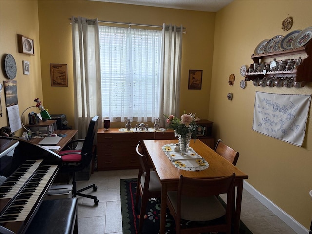817 Tallgrass Ln, Bradenton, FL 34212 - dining room with light tile patterned floors and a desk