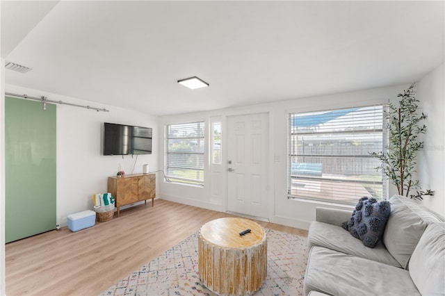 2715 Herwald St, Sarasota, FL 34231 - living area featuring light wood-type flooring and baseboards