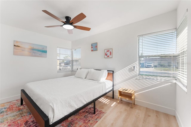 2715 Herwald St, Sarasota, FL 34231 - bedroom featuring light wood-type flooring, baseboards, and a ceiling fan
