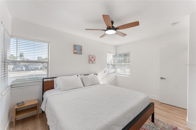 2715 Herwald St, Sarasota, FL 34231 - bedroom with light wood finished floors and a ceiling fan