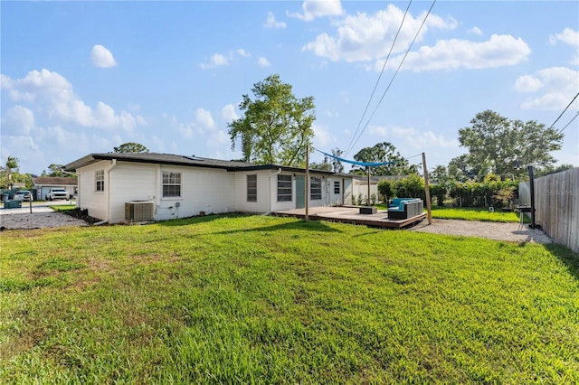 2715 Herwald St, Sarasota, FL 34231 - back of house with central AC and a deck