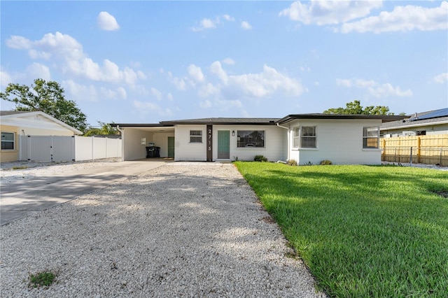 2715 Herwald St, Sarasota, FL 34231 - ranch-style home with driveway and a carport
