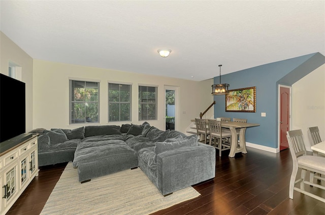 4500 Chinkapin Dr, Sarasota, FL 34232 - living room with dark wood-style flooring, baseboards, and stairway