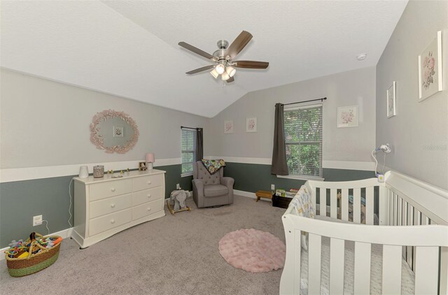 4500 Chinkapin Dr, Sarasota, FL 34232 - bedroom featuring a nursery area, lofted ceiling, carpet, and a ceiling fan