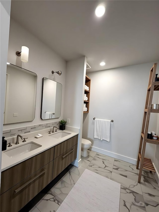 33 S Palm Ave Unit 1202, Sarasota, FL 34236 - bathroom featuring marble finish floors, toilet, baseboards, recessed lighting, and double vanity