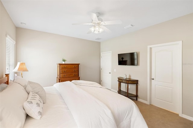bedroom featuring a ceiling fan and baseboards