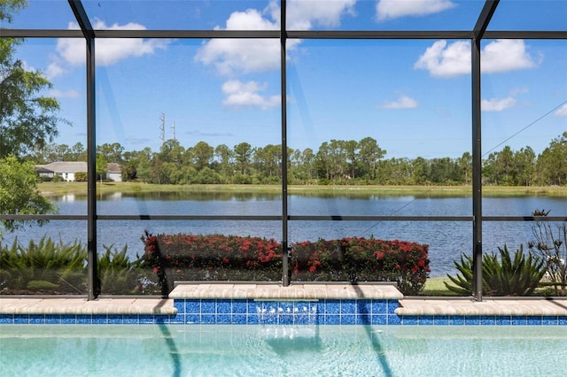 outdoor pool featuring a water view