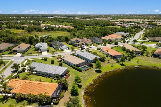 aerial view of residential area featuring a nearby body of water