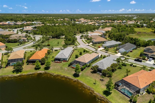 aerial perspective of suburban area with a large body of water