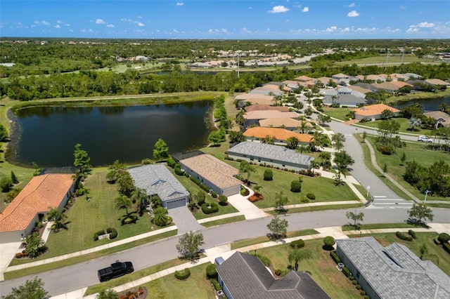 view of property location with a nearby body of water and nearby suburban area