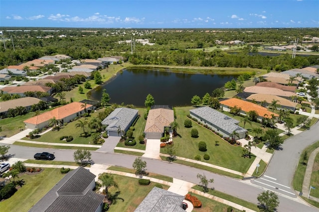 aerial perspective of suburban area featuring a nearby body of water