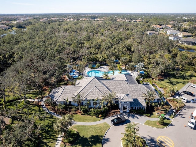 aerial view of a pool and a forest