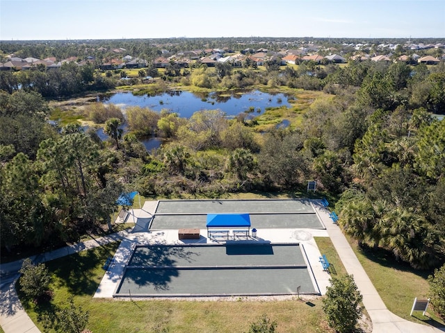 aerial view of residential area featuring a large body of water