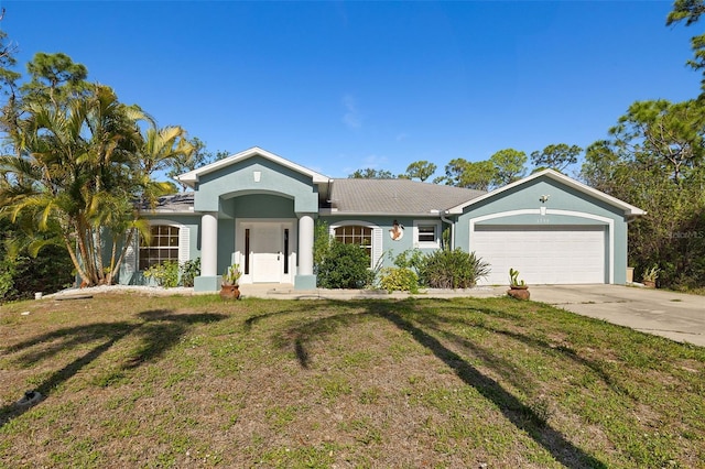 1399 Shields St, Punta Gorda, FL 33980 - single story home with stucco siding, a front yard, a garage, and concrete driveway