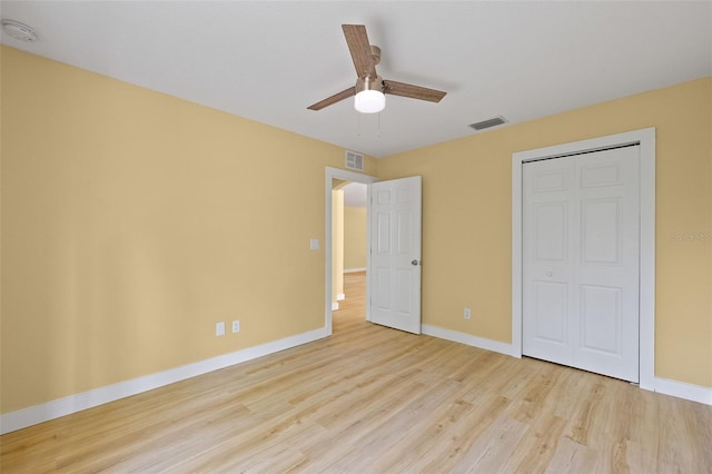 1399 Shields St, Punta Gorda, FL 33980 - unfurnished bedroom with wood finished floors, baseboards, a ceiling fan, and a closet