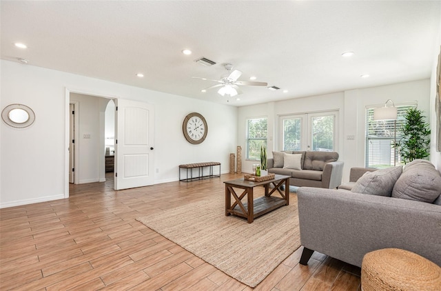 1345 24th St, Sarasota, FL 34234 - living area with ceiling fan, light wood-type flooring, recessed lighting, arched walkways, and baseboards