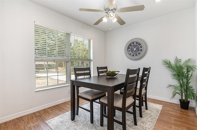 1345 24th St, Sarasota, FL 34234 - dining area featuring baseboards, light wood-style floors, and ceiling fan