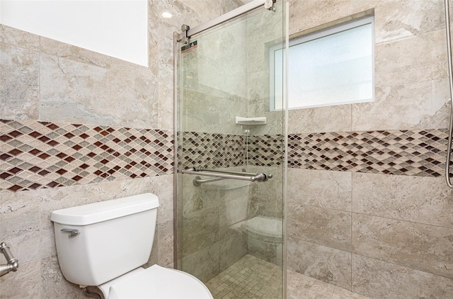 1345 24th St, Sarasota, FL 34234 - full bath with a shower stall, toilet, and tile walls