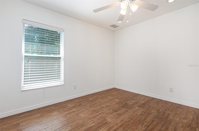 1345 24th St, Sarasota, FL 34234 - unfurnished room featuring wood finished floors, ceiling fan, baseboards, and recessed lighting