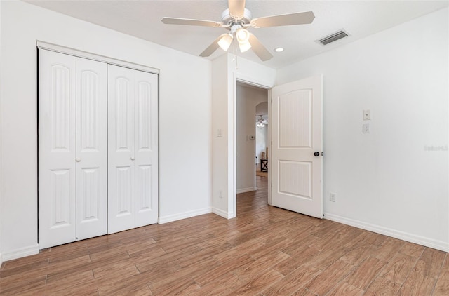 1345 24th St, Sarasota, FL 34234 - unfurnished bedroom with light wood-style floors, a closet, baseboards, ceiling fan, and recessed lighting