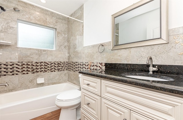 1345 24th St, Sarasota, FL 34234 - bathroom with shower / bath combination, vanity, toilet, and wood finished floors
