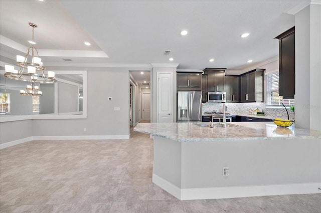 6250 Grandview Hill Ct, Bradenton, FL 34203 - kitchen featuring appliances with stainless steel finishes, a sink, crown molding, light stone counters, and dark brown cabinets