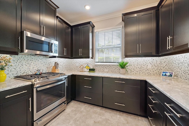 6250 Grandview Hill Ct, Bradenton, FL 34203 - kitchen with appliances with stainless steel finishes, ornamental molding, tasteful backsplash, light stone counters, and light tile patterned floors