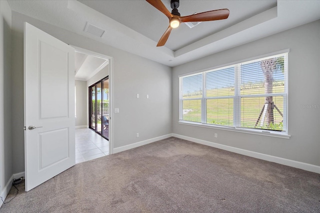 6250 Grandview Hill Ct, Bradenton, FL 34203 - carpeted spare room with baseboards, a ceiling fan, and a raised ceiling