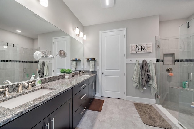 6250 Grandview Hill Ct, Bradenton, FL 34203 - full bathroom featuring a stall shower, double vanity, and baseboards