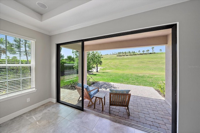 6250 Grandview Hill Ct, Bradenton, FL 34203 - doorway to outside featuring healthy amount of natural light, baseboards, light tile patterned floors, and ornamental molding