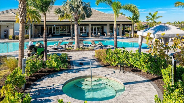 6250 Grandview Hill Ct, Bradenton, FL 34203 - community pool featuring a hot tub and a patio area