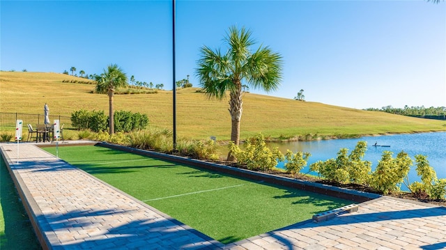 6250 Grandview Hill Ct, Bradenton, FL 34203 - view of community featuring a bocce ball area, fence, and a water view