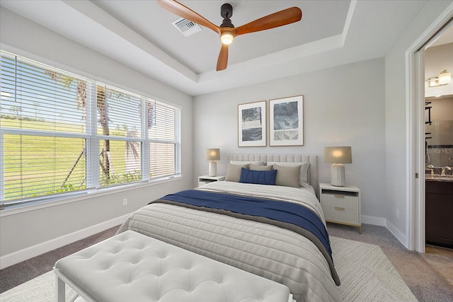 6250 Grandview Hill Ct, Bradenton, FL 34203 - bedroom with baseboards, carpet flooring, a tray ceiling, and ceiling fan