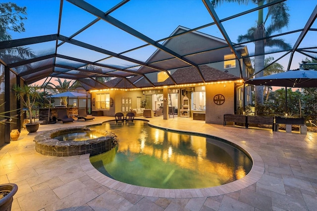 6907 47th Ct E, Ellenton, FL 34222 - view of pool with a patio area, a pool with connected hot tub, and glass enclosure
