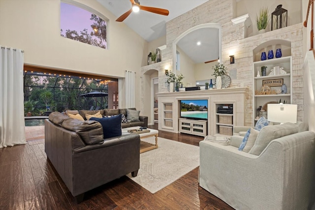 6907 47th Ct E, Ellenton, FL 34222 - living area featuring ceiling fan, high vaulted ceiling, arched walkways, dark wood-style flooring, and built in features