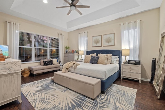 6907 47th Ct E, Ellenton, FL 34222 - bedroom with a raised ceiling, wood finished floors, baseboards, and ceiling fan