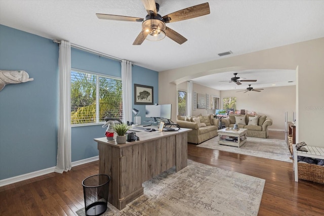 6907 47th Ct E, Ellenton, FL 34222 - office area with a ceiling fan, dark wood-style flooring, arched walkways, and healthy amount of natural light
