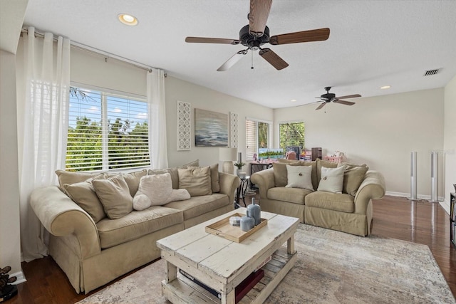 6907 47th Ct E, Ellenton, FL 34222 - living area with wood finished floors, a ceiling fan, recessed lighting, baseboards, and a textured ceiling