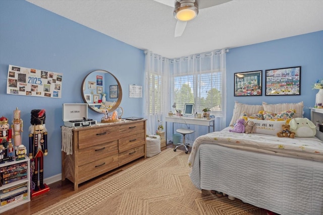 6907 47th Ct E, Ellenton, FL 34222 - bedroom with ceiling fan, light wood finished floors, and baseboards